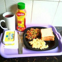 A picture of Hibiscus tea,bread and eggs.