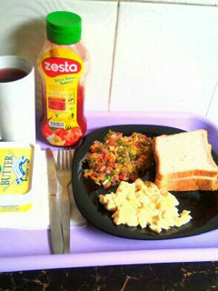 A picture of Hibiscus tea,bread and eggs.