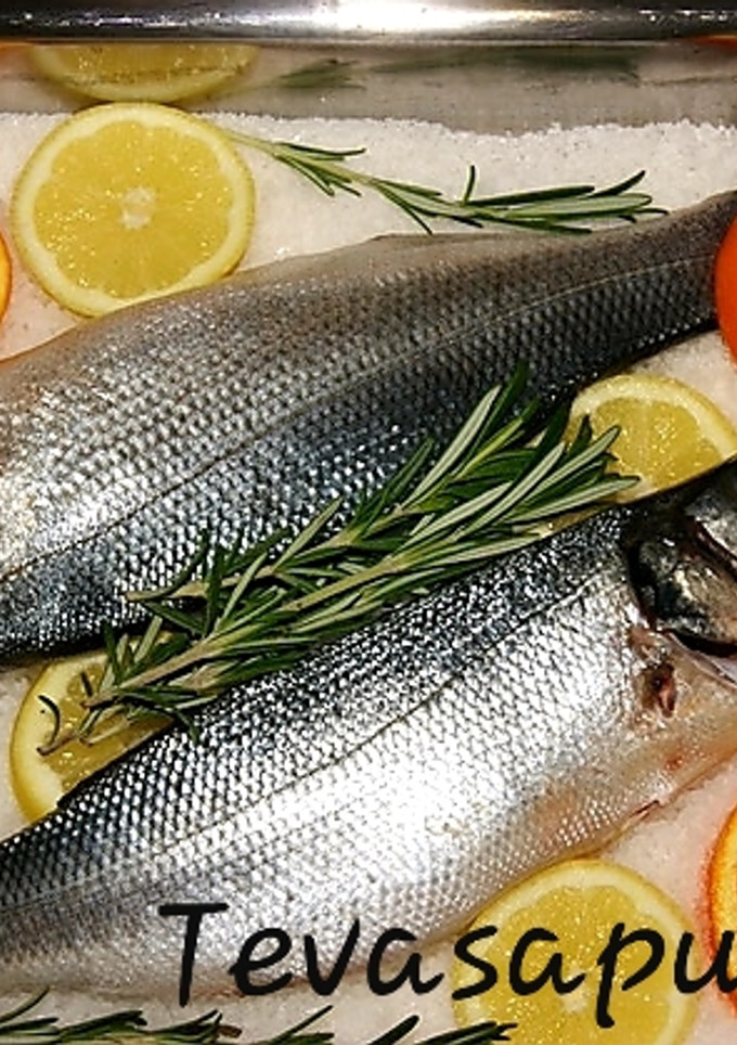 Una foto de Lubina a la sal 🍊🍋 🍊🍃 🐟
