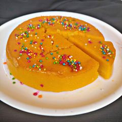 A picture of Caramel Mango Bread Pudding (eggless).