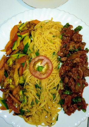 A picture of Spaghetti on tomato sauce,wet fry beef, sauteed vegetables..,.