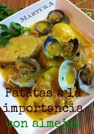 Una foto de Patatas a la importancia con almejas