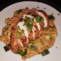 A picture of Zahtar spiced chicken with creamy lentils and cougette.