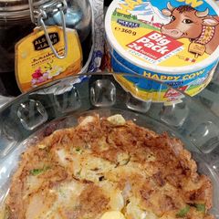 A picture of Onion omelette with bread.