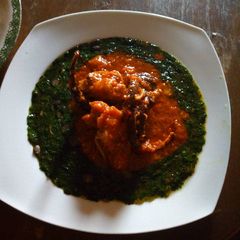 A picture of Ewedu soup and tomatoes stew.