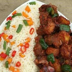 A picture of Rice with fried beef.