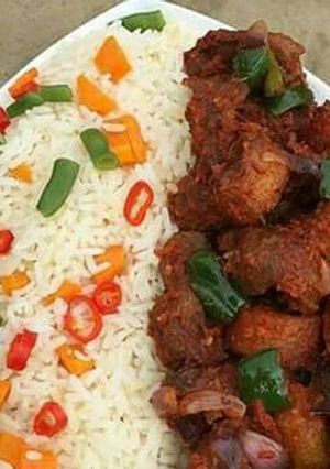 A picture of Rice with fried beef.