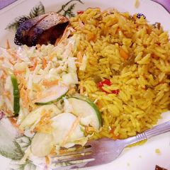 Turmeric rice and salad A picture of Turmeric rice and salad.
