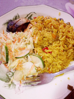 A picture of Turmeric rice and salad.