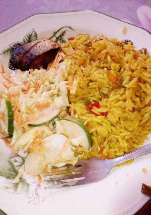 A picture of Turmeric rice and salad.