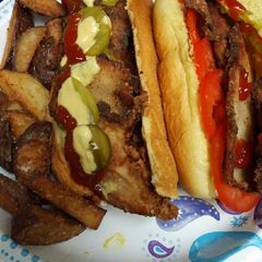 A picture of Fried Greek Inspired Pork Sandwich.