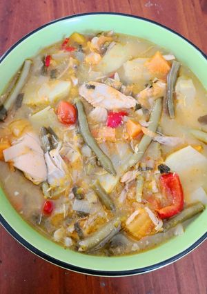 A picture of Chicken soup with Squash, French Beans & Tomato.