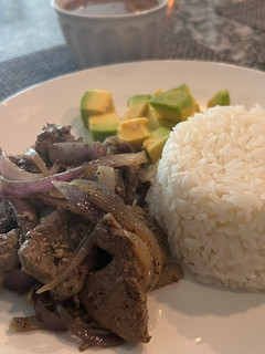 A picture of Beef liver with grilled onions.