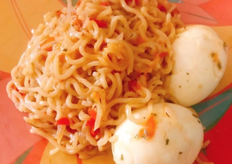 Jollof noodles and boiled egg