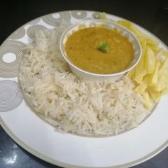 A picture of Shadiyun wala Daal Chicken with zeera rice and fries.