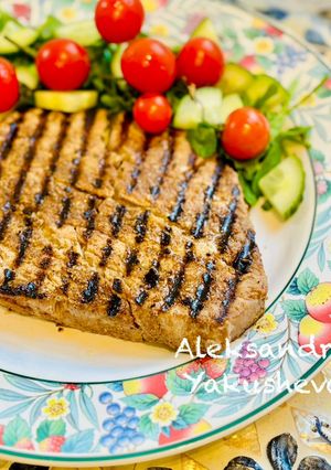 A picture of Tuna fillet on a grill pan.