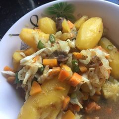 A picture of Gizzard and Irish potato Sauce.