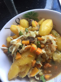A picture of Gizzard and Irish potato Sauce.