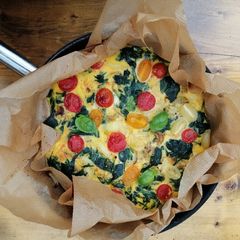 Spinach, onion and cherry tomato frittata A picture of Spinach, onion and cherry tomato frittata.