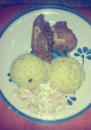 A picture of Fried rice, vegetables and chicken.