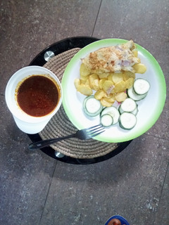 A picture of Chips with egg, cocumber & sauce.