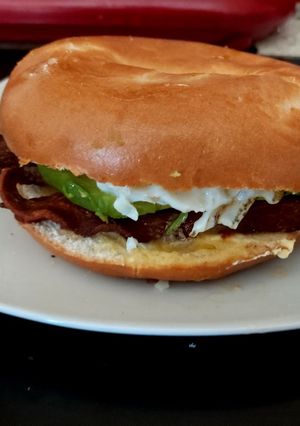 A picture of My Avocado Streaky Bacon and Fried Egg Bagel. 💜.