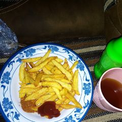A picture of Chips with ketchup.