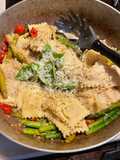 Ravioli with tomatoes and asparagus
