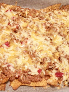 Una foto de Nachos con carne y queso