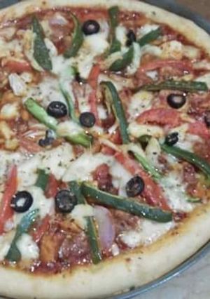 A picture of Pizza 🍕 in tikka flavor.