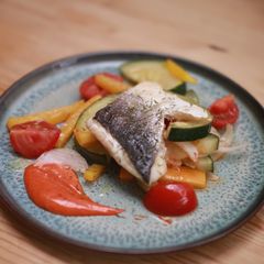 A picture of Seabass with braised courgettes & Gochujang mayo.