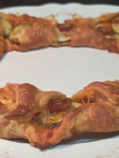 Una foto de Rosca de calabacín y tomates cherry