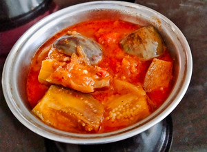 A picture of Brinjal In Onion Tomato Gravy.