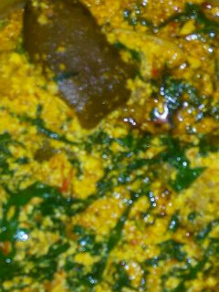 A picture of Egusi soup and goat meat.