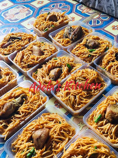 A picture of Jollof Spaghetti with veggies.