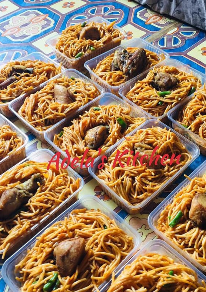 A picture of Jollof Spaghetti with veggies.