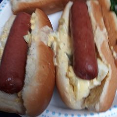 A picture of Hotdogs with Egg-salad.