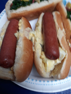 A picture of Hotdogs with Egg-salad.