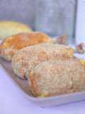 Muslos al horno empanados con patata y queso