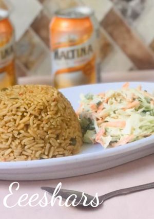 A picture of Jollof rice and coleslaw.