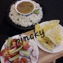 A picture of Toor ki tadke vali dal aur plain jeera rice.