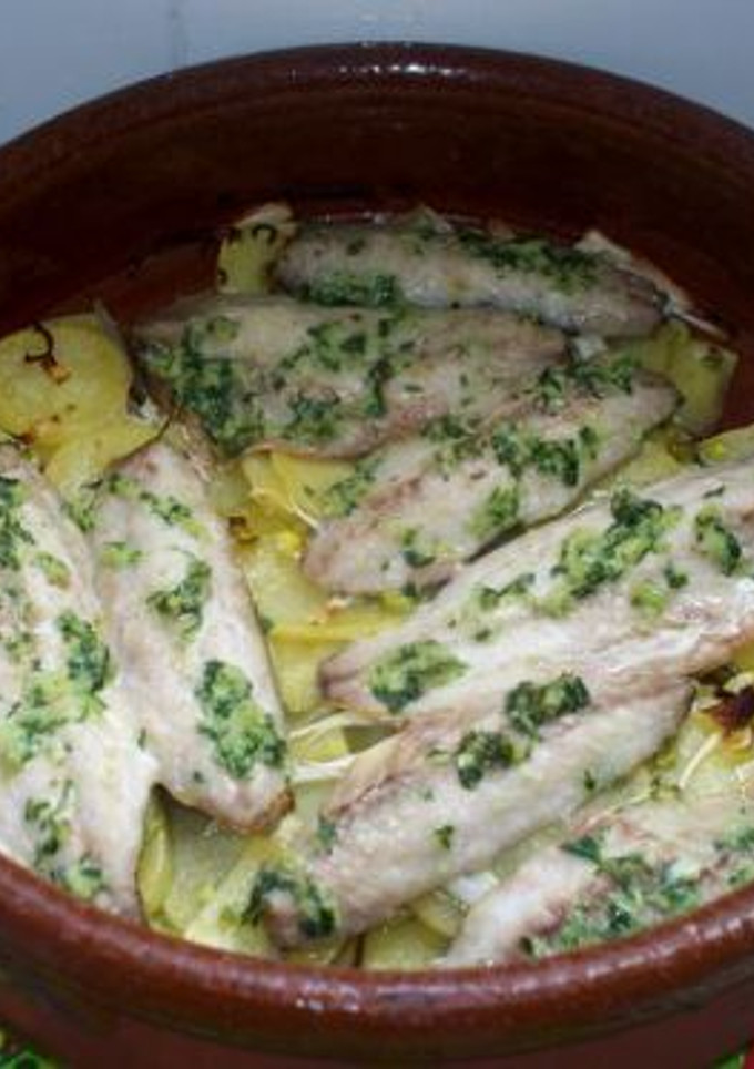 Una foto de Jureles al horno con patatas