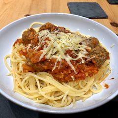 A picture of Meatballs, Rich Tomato sauce with Garlic Spaghetti.