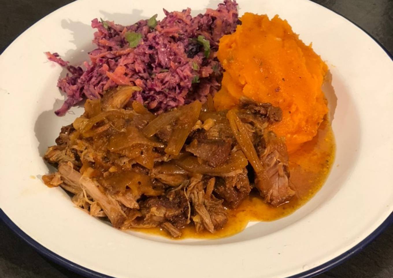 Slow cooked pulled pork with sweet potato mash and healthy slaw