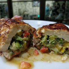 A picture of Broccoli and cheese wrapped in chicken breasts.