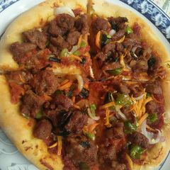 A picture of Homemade pizza without cheese.