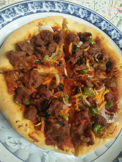 A picture of Homemade pizza without cheese.