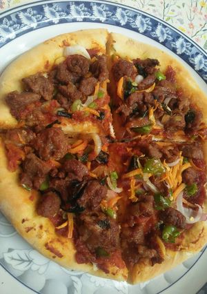 A picture of Homemade pizza without cheese.