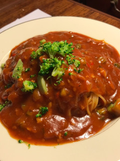 A picture of An Asian Woman and her Spaghetti Sauce.