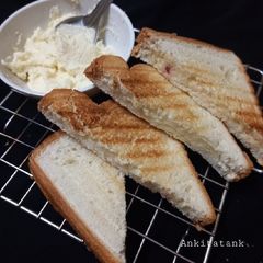 A picture of Cheese spread bread toast.